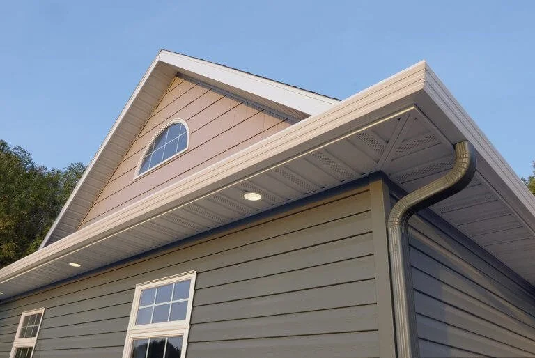 New seamless gutter and downspout on a home